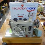 A GAMAGES STRAIGHT STITCH SEWING MACHINE, TOGETHER WITH A CIRCULATION MAXX ULTRA NEURO-MUSCULAR