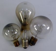 THREE LARGE PLAIN GLASS VINTAGE GLOBE ELECTRIC LIGHT BULBS, one labelled - Crompton made in UK,