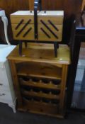 A VINTAGE LIGHTWOOD CANTILEVER SEWING BOX AND CONTENTS, TOGETHER WITH A SMALL PINE WINE RACK/