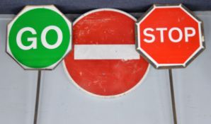 SIGNAGE: Pair of vintage Ministry of Transport octagonal STOP/GO signs on heavy steel poles, plus