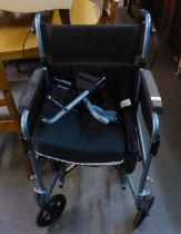 AN ESCAPE LITE FOLDING WHEELCHAIR