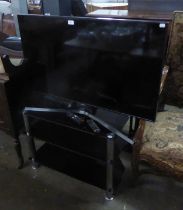 A SAMSUNG 43" SMART TV, A PYSC TORRE XL RADIO AND SPEAKER AND A GLASS TV STAND (3)