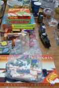 A SMALL SELECTION OF TOYS TO INCLUDE; A SMALL PLASTIC TRAIN AND CARRIAGE; LOTTO GAME; TELL ME QUIZ