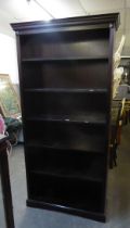 A LARGE DARK MAHOGANY SIX TIER OPEN BOOKCASE