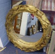 LARGE CIRCULAR GOLD FRAMED WALL MIRROR, WITH BRANCH DECORATION, 26 1/2" diameter (MIRROR) 36"