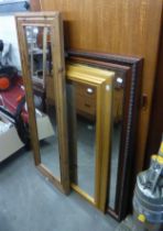 A MAHOGANY FRAMED OBLONG WALL MIRROR, 117cm x 91cm A GILT FRAMED OBLONG WALL MIRROR 107cm x 76cm AND