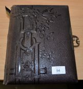 EMBOSSED LEATHER BOUND PHOTOGRAPH ALBUM, WITH METAL HASP FASTENER, CONTAINING SOME VICTORIAN