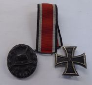 COPY OF A GERMAN WWI IRON CROSS 2ND CLASS 1870, AS A BROOCH; A GERMAN BRONZED METAL OVAL LAPEL BADGE