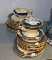 BURLEIGH WARE POTTERY PART DINNER SERVICE, WITH SPONGED BROAD BLUE BORDERS WITH GILT PATTERNED