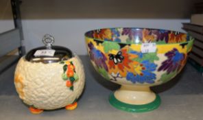 CLARICE CLIFF 'HARVEST PATTERN' BISCUIT BARREL AND A DOULTON PEDESTAL FRUIT BOWL (2)