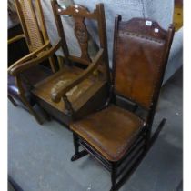 AN EARLY NINETEENTH CENTURY BENTWOOD NURSING CHAIR, ON CURVED ROCKERS, HIDE BACK AND SEAT,