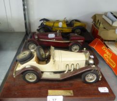 THREE VINTAGE CARS ON WOODEN BASES, TOGETHER WITH READERS DIGEST VINTAGE CARS PLUS (AS NEW) IN BOXES