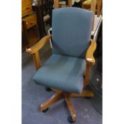 A STURDY PINE OFFICE ARMCHAIR, ON FIVE SPUR BASE, TOGETHER WITH A LOW SEATED OPEN ARMCHAIR WITH
