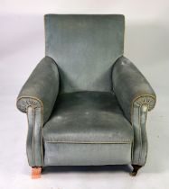 A HOWARD STYLE ARMCHAIR covered in light blue fabric raised on turned front legs