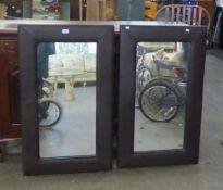 MIRRORS; PAIR OF BROWN CUSHION FRAMED MIRRORS, 40" (101.5cm) wide (2)