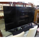 A SAMSUNG 49" FLAT SCREEN TV, MODEL UE49 NU8000T AND A SAMSUNG SOUND BAR, MODEL HW-560T (2)