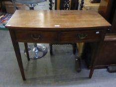 A MAHOGANY BOW-FRONTED SIDE TABLE WITH TWO FRIEZE DRAWERS