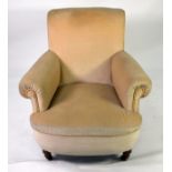 A HOWARD STYLE BOW FRONT ARMCHAIR covered in Beige fabric raised on turned front legs
