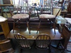 ERCOL REFECTORY STYLE TABLE AND FOUR HOOP BACK DINING CHAIRS [5]