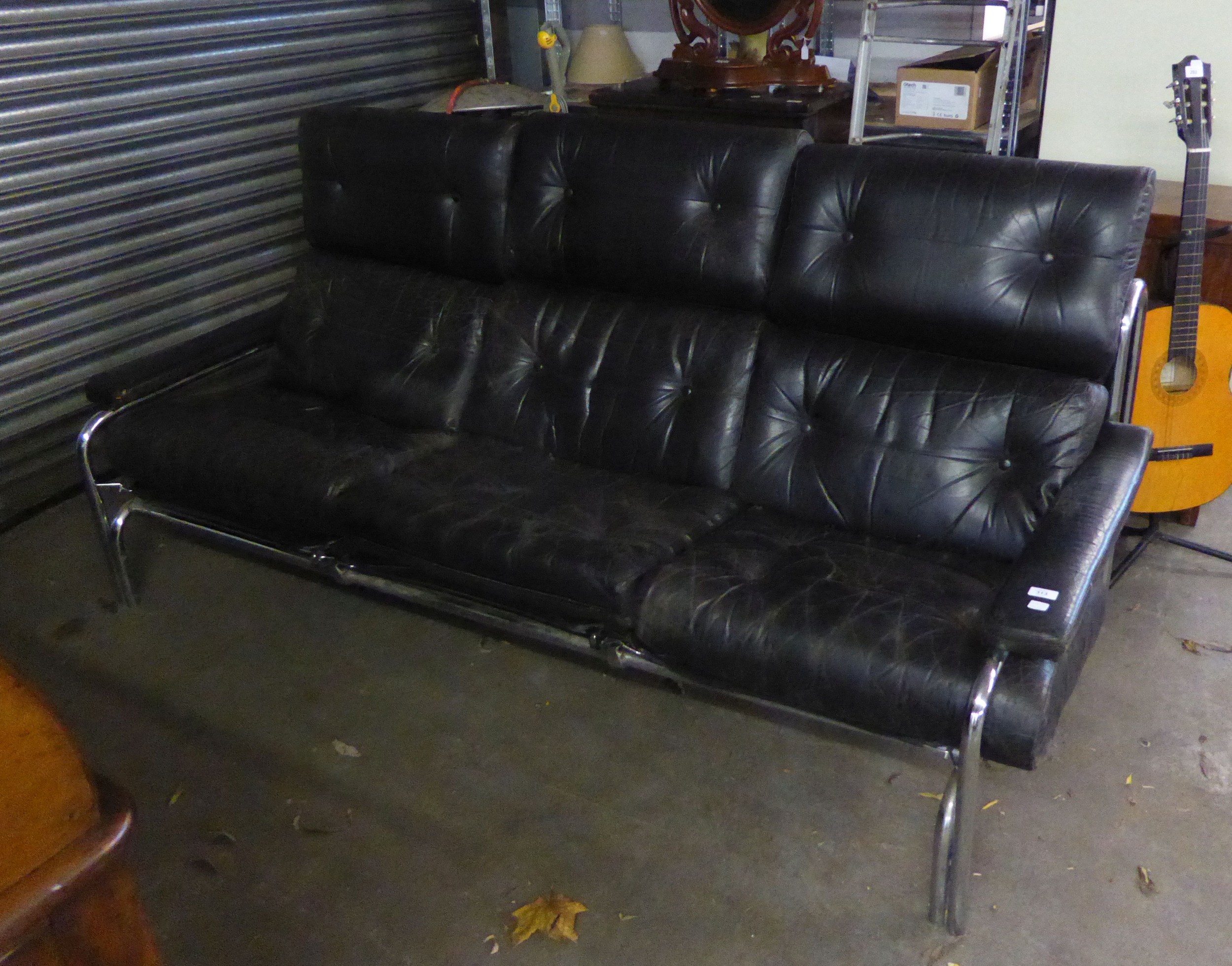 A PIEFF THREE SEATER ALPHA BLACK LEATHER SOFA, ON CHROME FRAME (NEEDS ATTENTION)