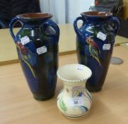 A PAIR OF STUDIO POTTERY OVULAR VASES, EMBOSSED WITH PARROTS AND A HONITON POTTERY VASE (3)