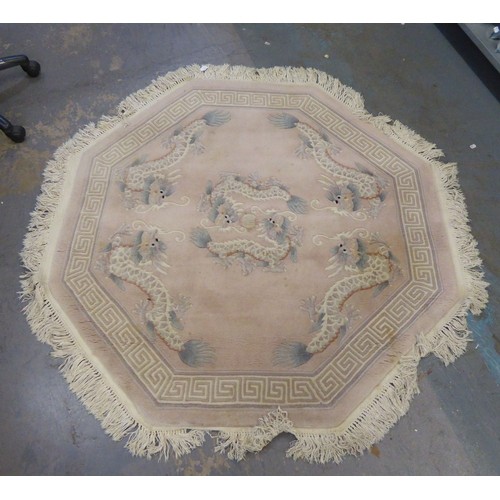 OCTAGONAL CHINESE RUG, WITH DRAGON PATTERN AND  A SMALLER RECTANGULAR BLUE RUG WITH ROSE PATTERN
