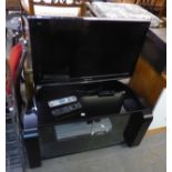 PANASONIC FLAT SCREEN TELEVISION, ON BLACK AND GLASS CORNER STAND, WITH ACCESSORIES