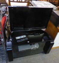PANASONIC FLAT SCREEN TELEVISION, ON BLACK AND GLASS CORNER STAND, WITH ACCESSORIES