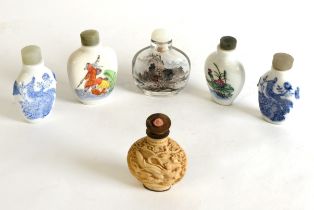 THREE ORIENTAL BLUE AND WHITE PORCELAIN SNUFF BOTTLES; ANOTHER, polychrome decorated; an inside-