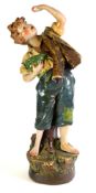 BRETBY STYLE PLASTER SHOP DISPLAY FIGURE of an urchin boy eating grapes, 28in (71cm) high, (as