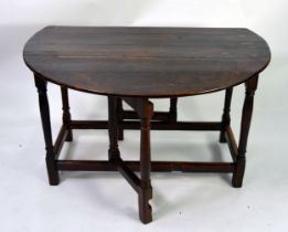 18th CENTURY DROP_LEAF TABLE, on turned legs united by a peripheral stretcher, plus six later rush-