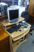 A BLOND WOOD SMALL COMPUTER DESK; ASUS COMPUTER TOWER; MEDION MONITOR; ASUS KEYBOARD; MOUSE; AND