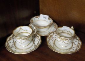 PAIR OF GEORGE JONES FOR CRESCENT CHINA DEMI TASSE COFFEE CUPS AND SAUCERS, DECORATED WITH RAISED