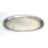 HUGH WALLACE, PLANISHED STAINLESS STEEL SMALL OVAL SHALLOW TRAY, with rope twist type border, 12”