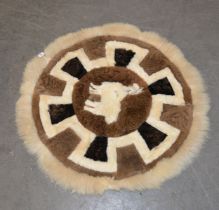 A GOATSKIN RUG AND TWO SIMILAR RUGS (3) (ONE A.F.)