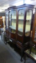 EDWARD VII/GEORGE V MAHOGANY DISPLAY CABINET WITH BOWED GLASS DOOR, WITH CABRIOLE LEGS AND SHELF