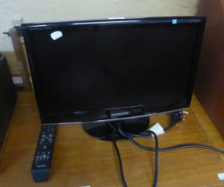 SAMSUNG SMALL FLAT SCREEN TELEVISION, WITH REMOTE CONTROL