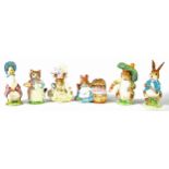 SIX BESWICK BEATRIX POTTER CHARACTER FIGURES, five with Gold backstamps namely 'HUNCA MUNCA', '