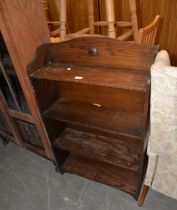 A SMALL OAK THREE TIER OPEN BOOKCASE AND A MAHOGANY BALLOON BACKED DINING CHAIR