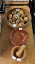 TREEN, VIZ A TURNED WOOD BOWL AND A QUANTITY OF DECORATED EGGS, PLUS A PESTLE AND MORTAR