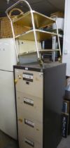 A BROWN AND CREAM METAL FOUR DRAWER FILING CABINET AND A TUBULAR METAL TALL TWO-TIER DINNER WAGON (