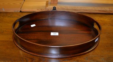 A SMALL MAHOGANY REPRODUCTION OVAL DRINKS TRAY