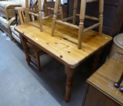 A PINE OBLONG KITCHEN TABLE WITH SIDE DRAWER AND A LIGHT OAK SINGLE CHAIR (2)