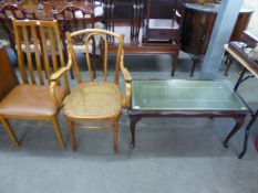 A REPRODUCTION MAHOGANY COFFEE TABLE WITH GREEN AND GILT LEATHER INSET TOP WITH GLASS PROTECTORS,