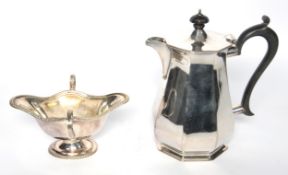 ELECTROPLATED HOT WATER JUG BY ROBERTS & BELK, of panelled baluster form with black scroll handle