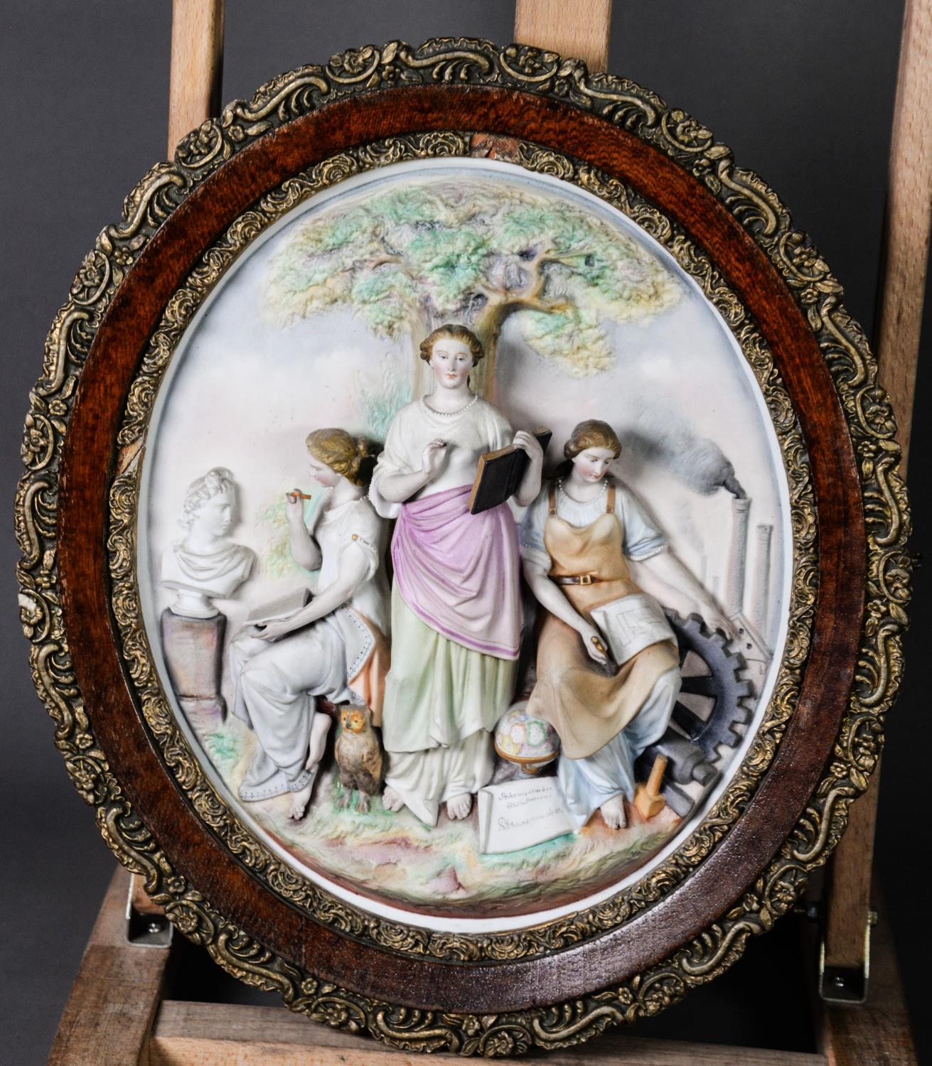 PAIR OF CONTINENTAL TINTED BISQUE ALLEGORICAL RELIEF MOULDED OVAL WALL PLAQUES, each painted in