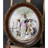PAIR OF CONTINENTAL TINTED BISQUE ALLEGORICAL RELIEF MOULDED OVAL WALL PLAQUES, each painted in