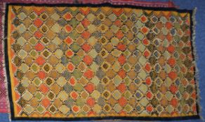 TUNISIAN FLAT WEAVE SMALL CARPET, with all-over diamond shaped diaper pattern on a sand coloured
