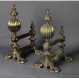 PAIR OF LARGE AND HEAVY BRASS CHENET, each with a large lobed, globular finial and four paw feet, 15