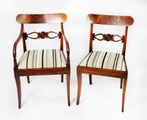 SET OF EIGHT REGENCY FIGURED AND CARVED MAHOGANY DINING CHAIRS, comprising: FOUR SINGLE CHAIRS and